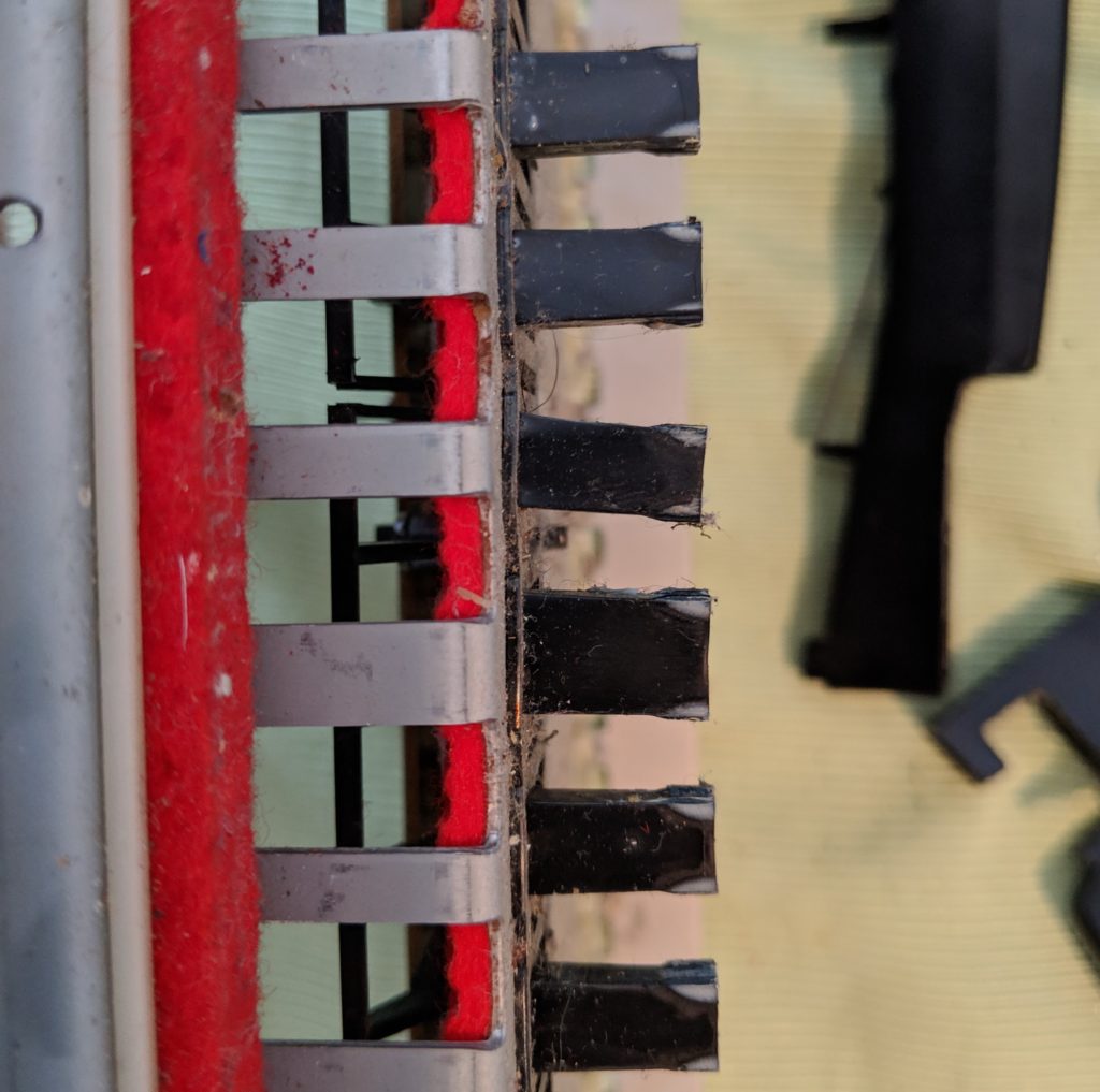 Bent guide post causing the stuck key