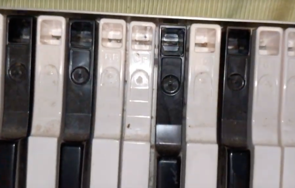 Spacing between keyboard and back metal rim of assembly with the plastic clip removed